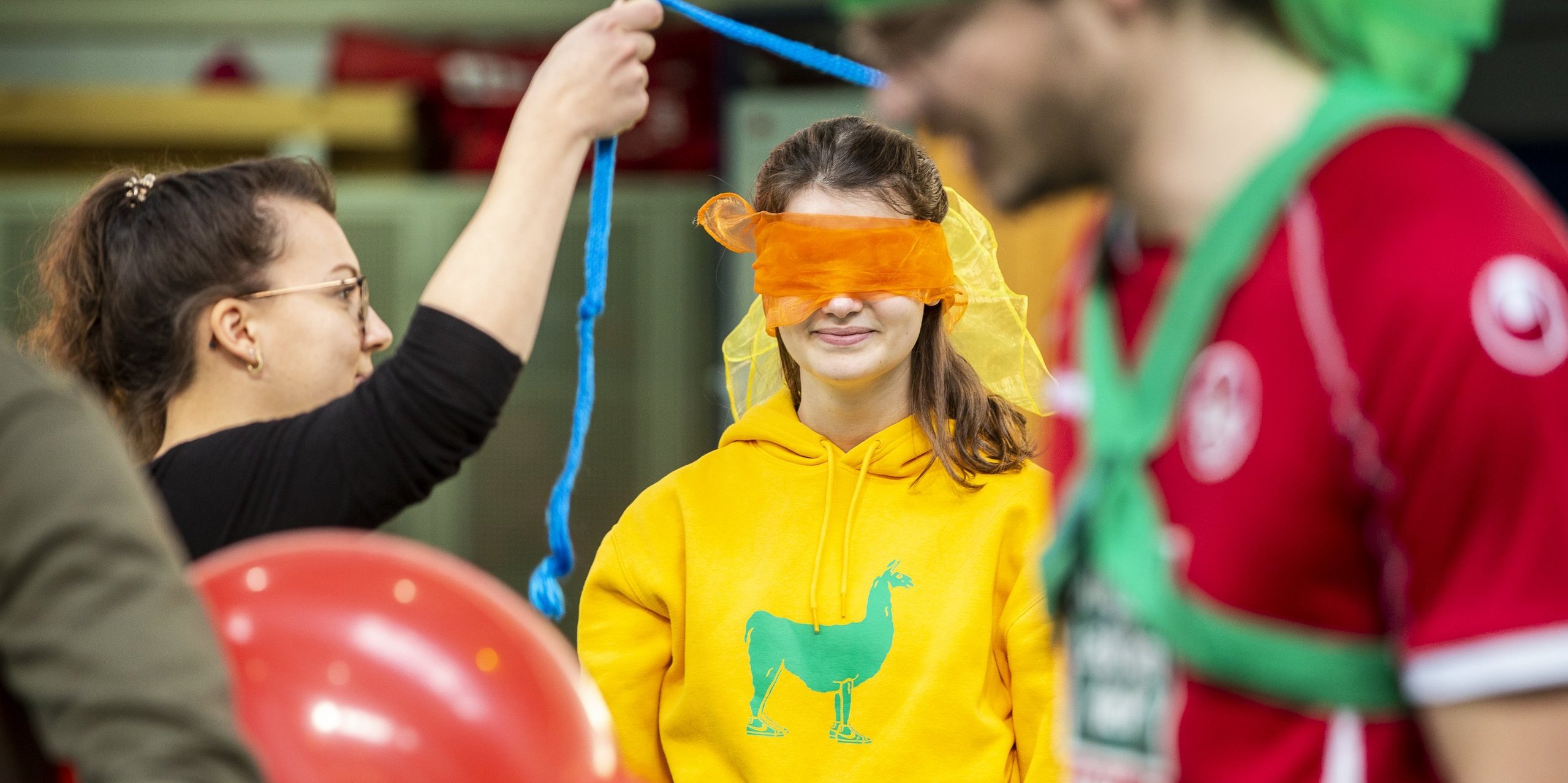 Person blindfolded in a course