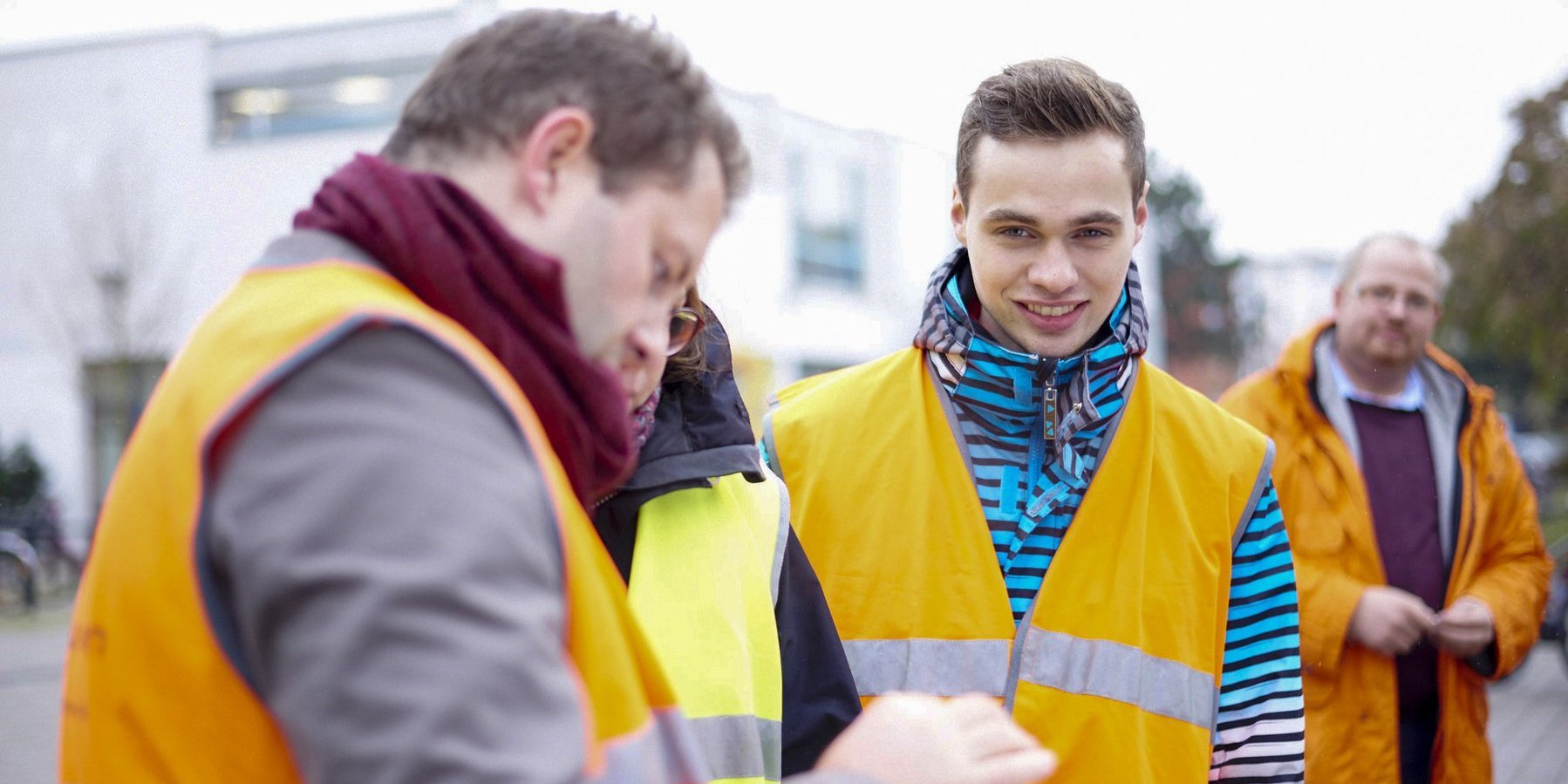 People in high visibility waistcoats